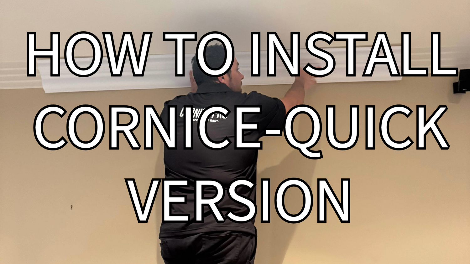 man placing cornice on wall with writing overlay how to install a cornice 